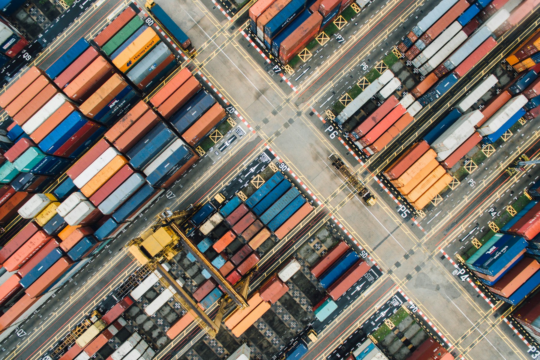 Shipping containers at a commercial port; illustrative stock photography